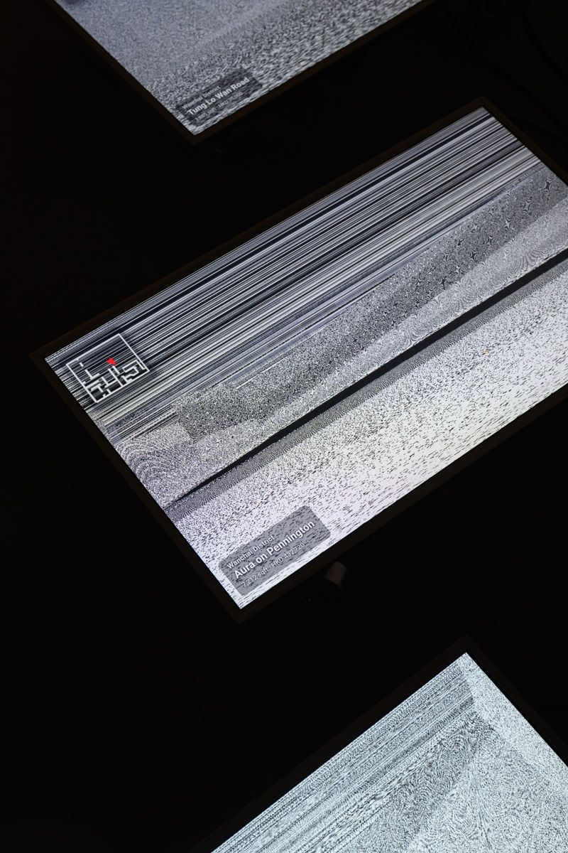 Screens seen from above, showing scanned interiors as grey noise.